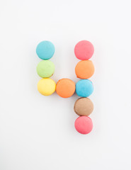 Fototapeta na wymiar colorful macarons arrangment is number four