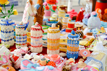 Fototapeta na wymiar Knitted goods displayed on market stall for sale. 