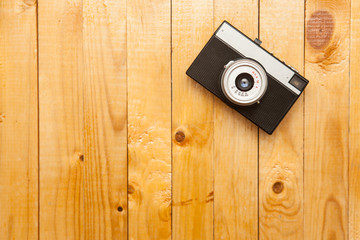 old camera on a wooden background