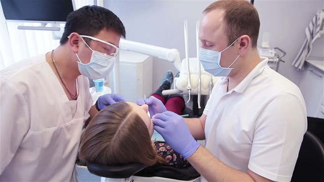 dentist treats teeth, doctor and reanimation