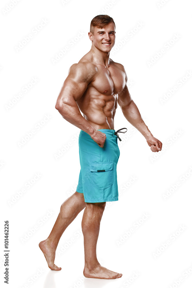 Wall mural Sexy athletic man showing muscular body, isolated over white background. Strong male nacked torso abs