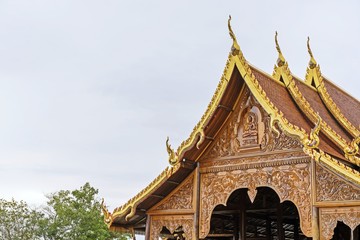 Fototapeta premium beautiful of Wooden carve : sermon hall in a monastery - Thailand public temple