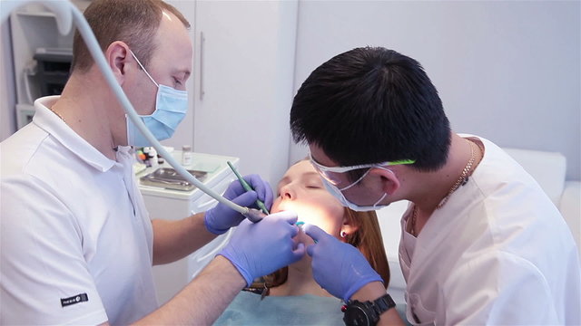 dentist treats teeth, doctor and reanimation