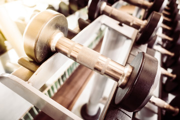 Fototapeta premium Dumbbell equipment in fitness gym room