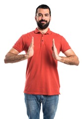 Fototapeta premium Handsome man holding something
