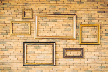 Blank photo frame on brick wall