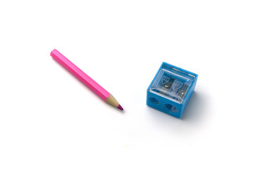 Pink pencil and blue sharpener are prepared for love writing.
