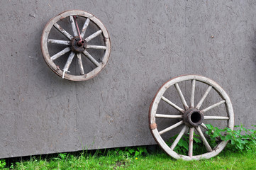 Old wooden wheels on the wall