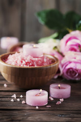 Fototapeta na wymiar SPA treatment with pink salt and candles