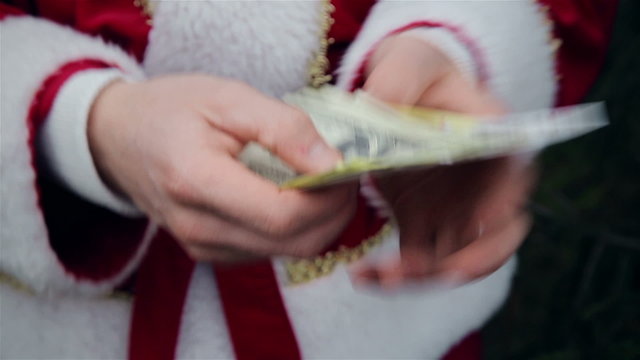 Santa Claus counting money