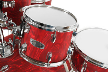 Fototapeta na wymiar Set of red drums isolated on white background, close up