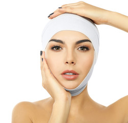 Young beautiful woman with an elastic bandage on her head, isolated on white