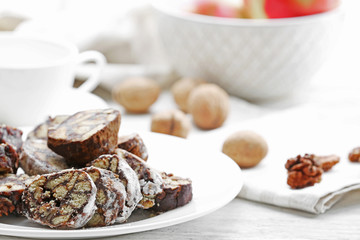 Chocolate salami on a plate, close up