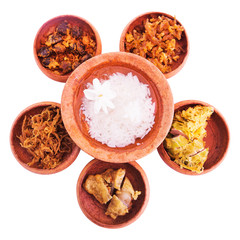 rice in ice water with side dishes such deep fried pork, onion,