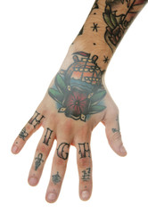 Abstract tattoo on male hand over white background