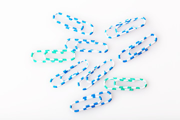 Collection of colourful paper clips, isolated on white