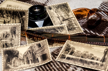 Fototapeta na wymiar old camera with photos and negative film strip