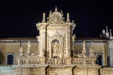 Fototapeta na wymiar Detail of Lecce Cathedral facade, iconic landmark in Salento