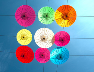 Colorful umbrella  hanging on the sky.