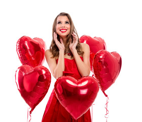 Adorable girl surrounded by red hearts