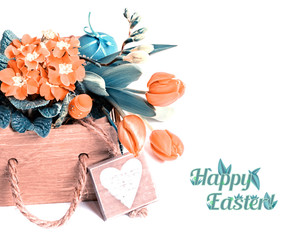  Easter border with orange flowers and spring decorations on whi