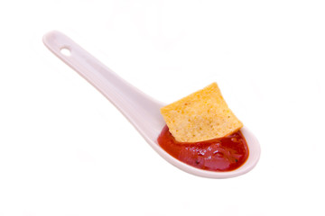 Teaspoon with hot sauce on white background