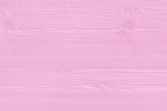 Natural wooden pink boards, wall or fence with knots. Abstract textured rozy background, empty template
