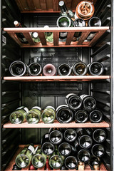 close up shot of a wine cellar. bottles of wine on the shelves - 101489625