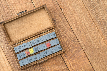 alphabet rubber stamp in wooden box