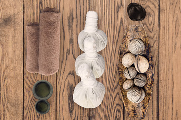 spa and massage accessories on wooden background