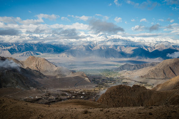 Fototapeta na wymiar Aerial view of Leh City, landscape with ice peaks , blue sky in background , Ladakh, Jammu and Kashmir, India