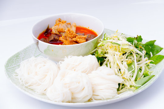 thai vermicelli eaten with chicken curry isolated on white backg