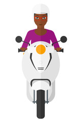 Woman riding scooter.