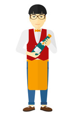 Waiter holding bottle of wine.