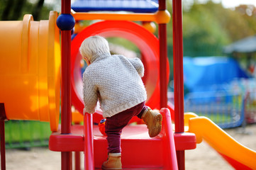 Toddler having fun on playground