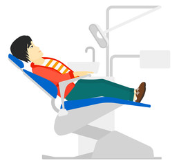 Patient in dental chair.