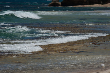 Oeacn tide on a beach with sunshine
