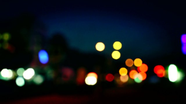 City Blur Background. Moving Bokeh Circles Of Night Traffic.