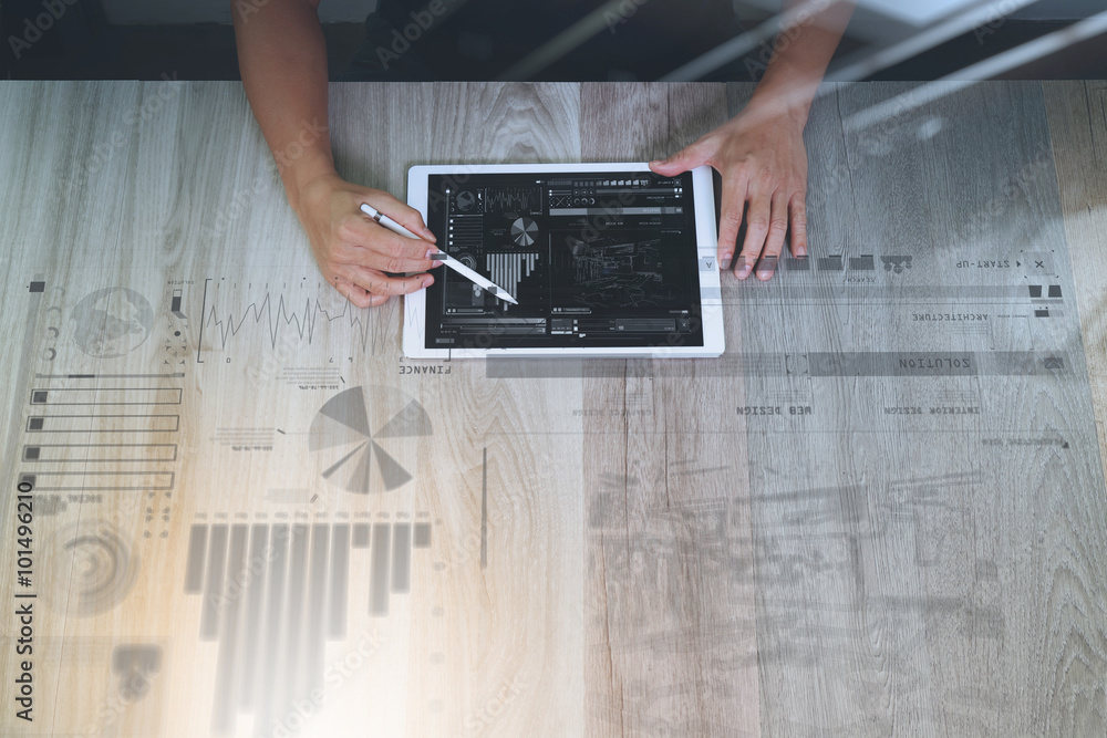 Poster top view of Designer hand working with digital tablet computer w