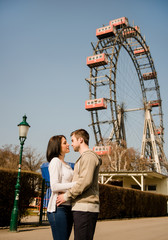 Young couple dating in amusement park