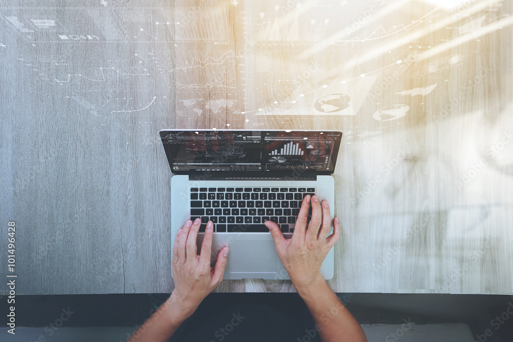 Poster Designer hand working with laptop computer on wooden desk as res