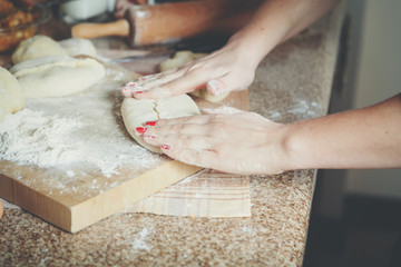 Female hands smooth roasted patty