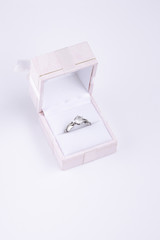 Diamond silver engagement ring in pink box isolated