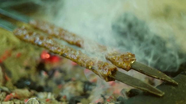 Barbecue grliling shish kebab slow motion