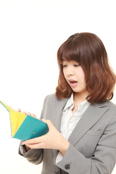 poor young Japanese businesswoman with empty wallet