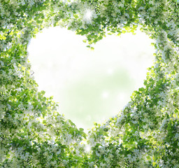 Spring background.Branches form a heart-shaped pattern