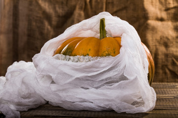Big pumpkin with cheesecloth
