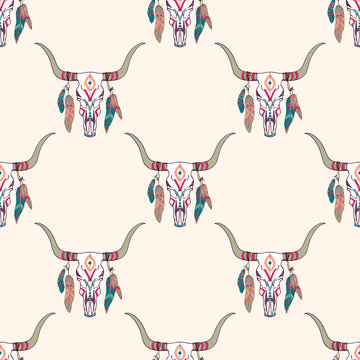 Vector tribal seamless pattern with bull skull and ethnic feathers. Boho style. American indian motifs.