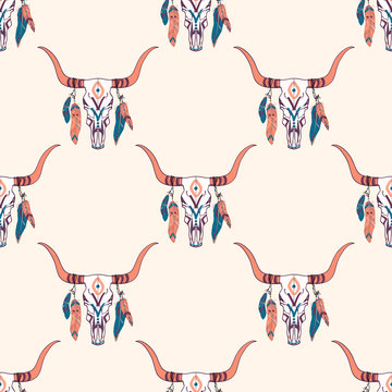 Vector tribal seamless pattern with bull skull and ethnic feathers. Boho style. American indian motifs.