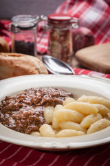 Potato dumplings with a sauce of beef.